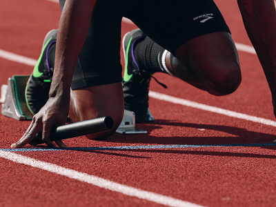 A runner preparing to sprint